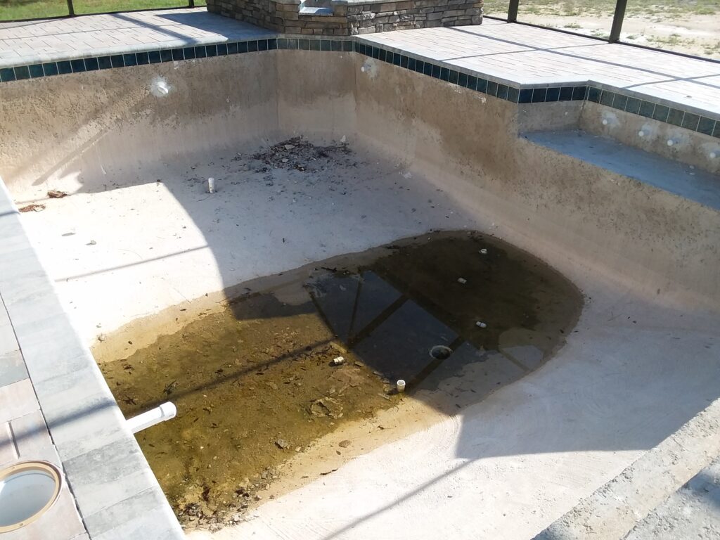 Pool main drains full of rock, trash and mud for over a year.